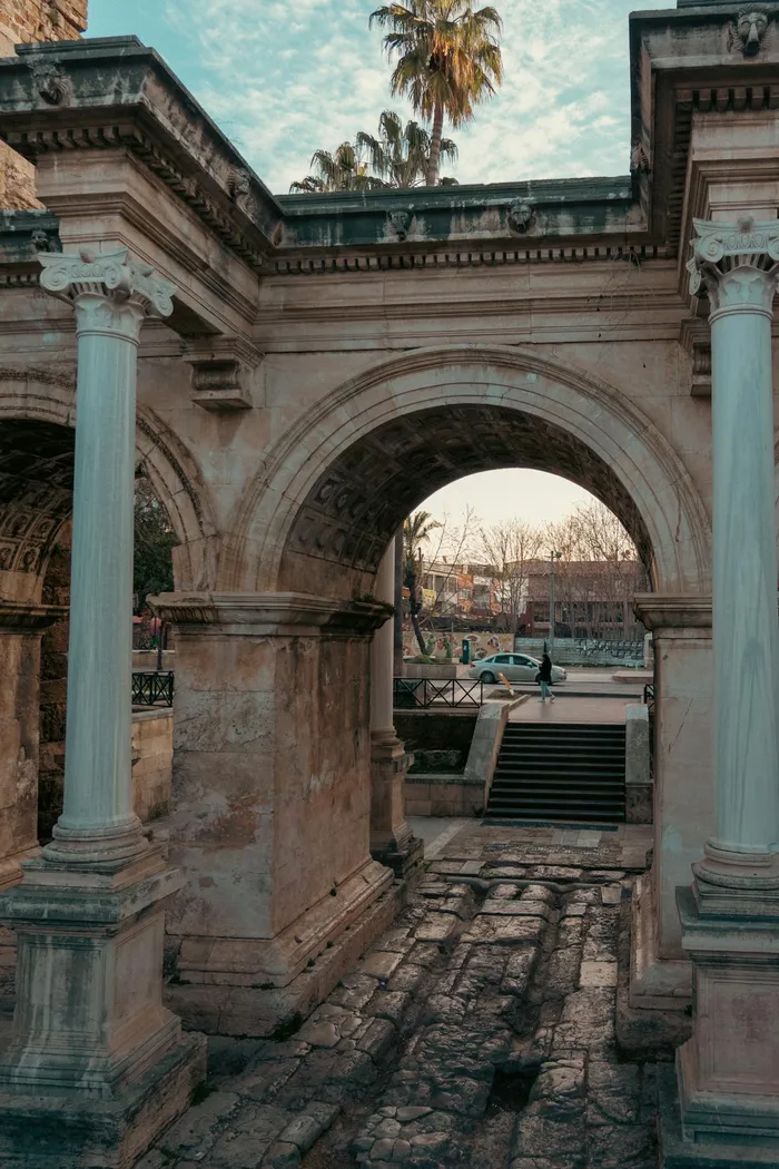 Hadrian's Gate in Antalya, Turkey — the ancient Roman triumphal arch that marks the entrance to Kaleici old town, a UNESCO-recognised historic district near Taki Dent dental clinic