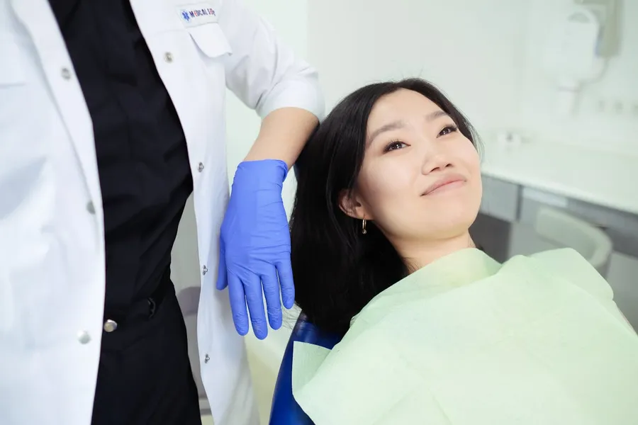 Patient with a brighter smile after professional laser teeth whitening at Taki Dent Antalya